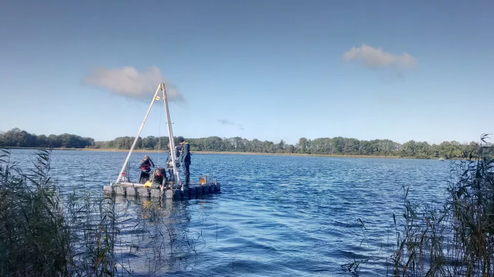 Raft with drill on a lake.